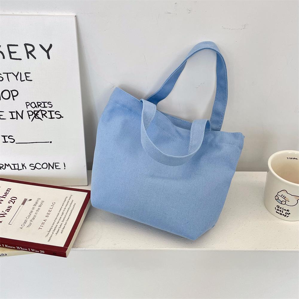

Blue solid color canvas small cloth bag, portable lunch box bag, cosmetic bag, sundries sorting bag, shopping handbag.