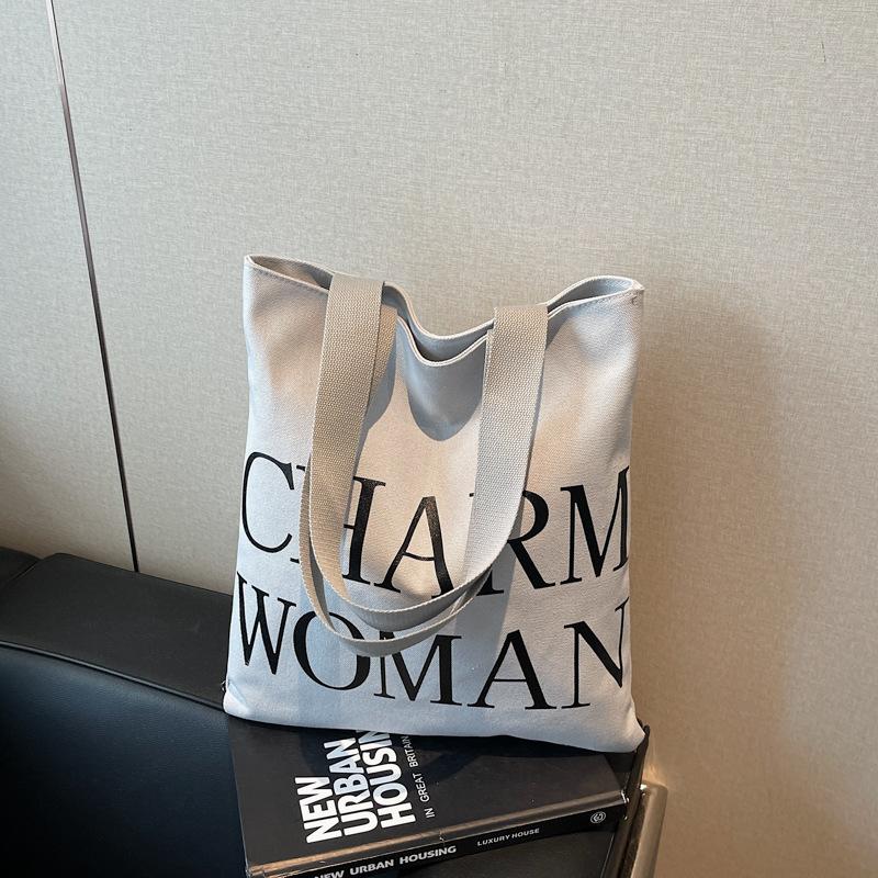 Large capacity alphabet canvas bag women's new fashion portable commuter bag versatile shoulder tote bag
