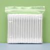 Pack of 100 double-ended, disposable cotton swabs with paper sticks for ear cleaning and makeup application.