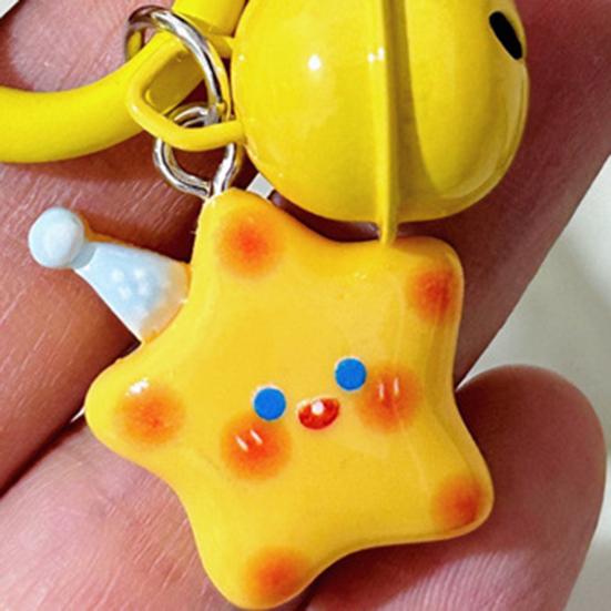 Schlüsselanhänger mit lächelndem Stern und Glöckchen, leicht, ideal als Geschenk für Freunde und Paare.