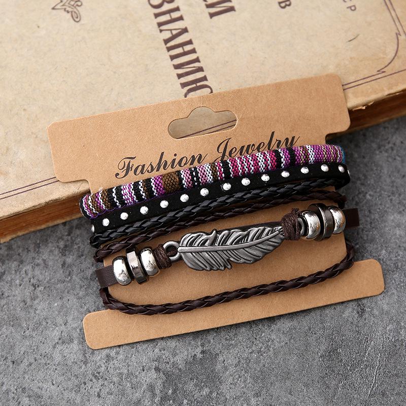 Europäisches & Amerikanisches Retro Feder Gewebtes Lederarmband mit Superman Accessoires - Herren Vierer-Set