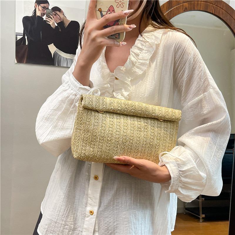 Large capacity new temperament fashionable design foreign style solid color straw woven texture hand envelope women's bag