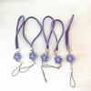 Camellia Four-Leaf Clover PU Leather Phone Wrist Lanyard with Nylon Woven Cord and Phone Case Pendant