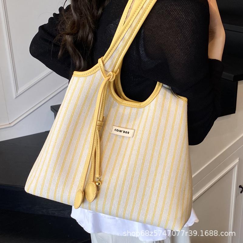 2025 lässige Pendler-Tragetasche Damen Nische gestreift schlicht Mode tragbare Umhängetasche große Kapazität Unterarmtasche