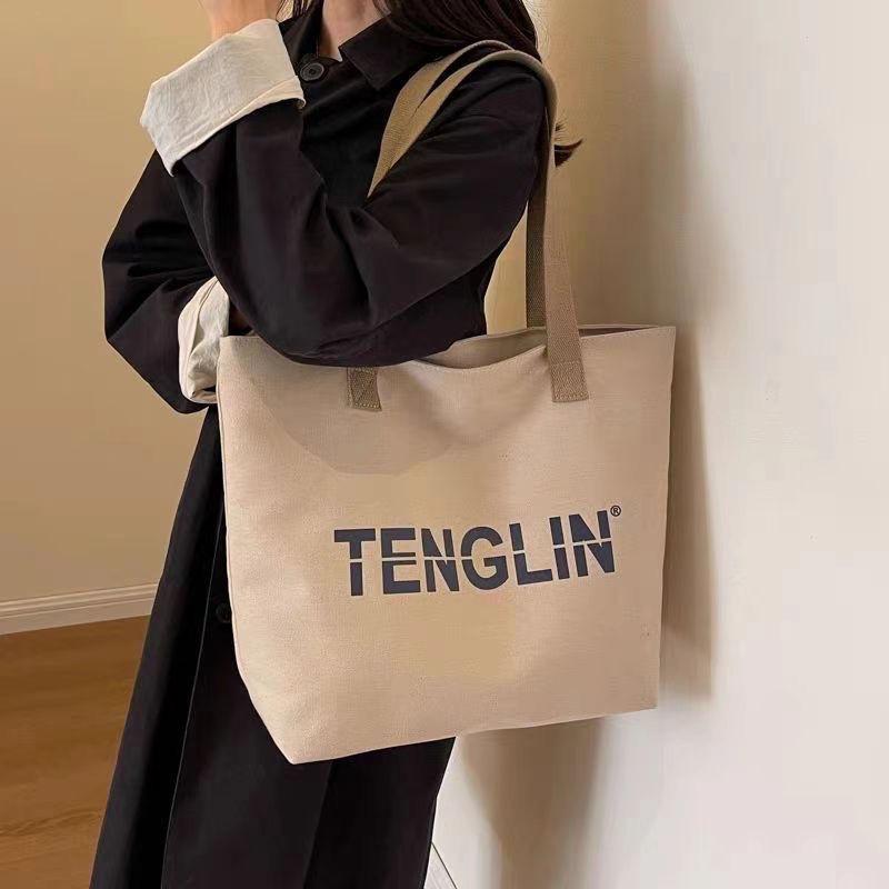 

Casual simple large-capacity bag women s 2025 new versatile shoulder commuter Korean version tote canvas bag