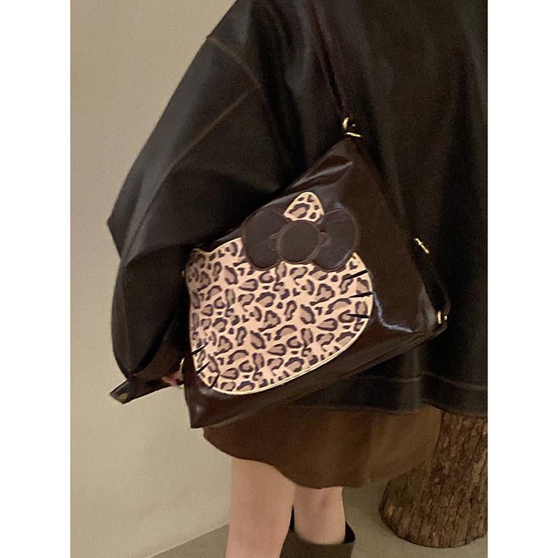 

Korean version of fashionable large-capacity underarm bag women s 2025 new cute cat tote bag commuter shoulder bag