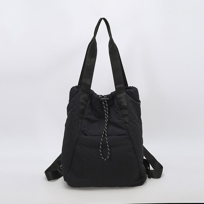 

Lightweight and large-capacity casual tote bag, simple and versatile waterproof nylon cloth shoulder bag, women s foreign style handbag. 30*15*40 чорний