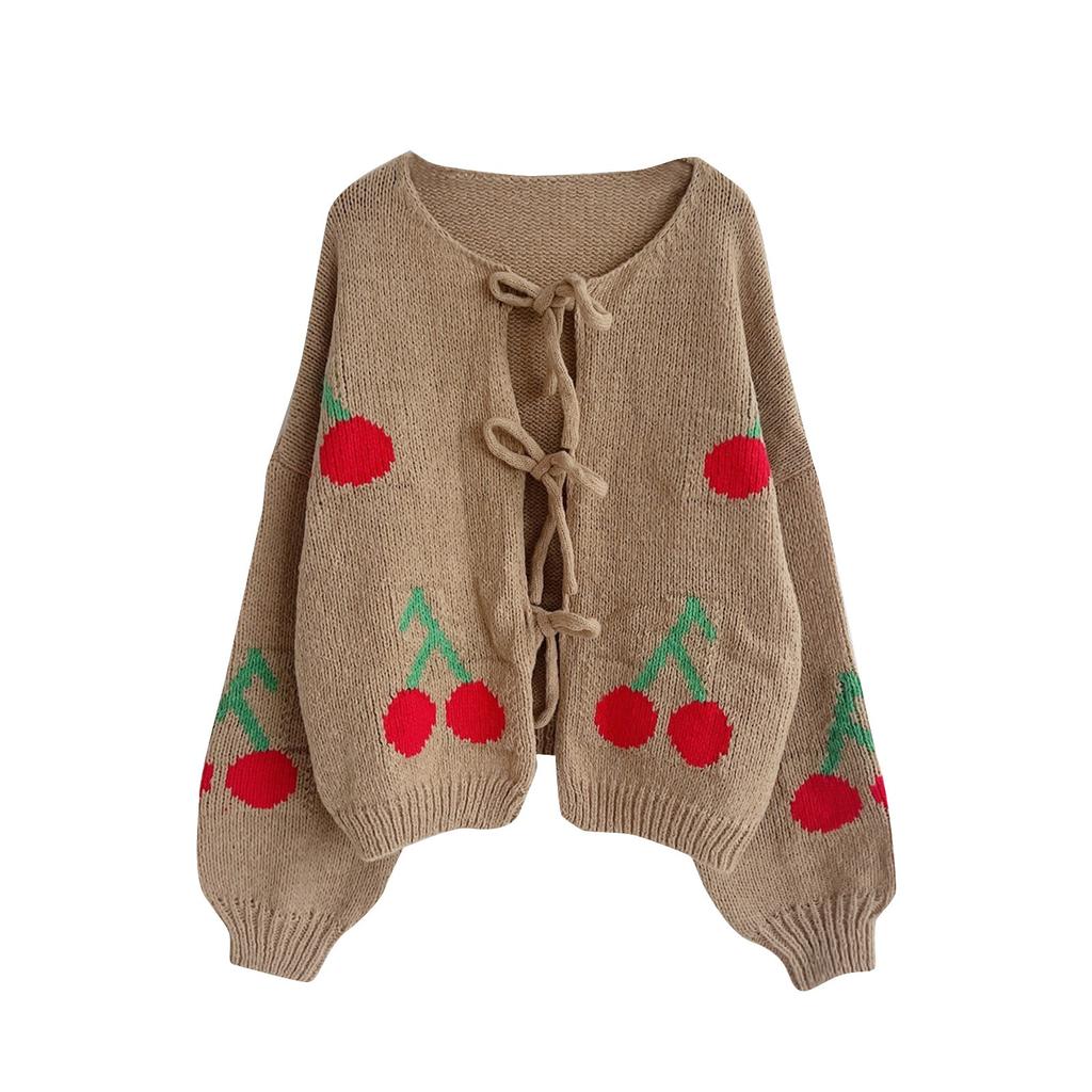 Damkofta i enfärgad stickning med snörning