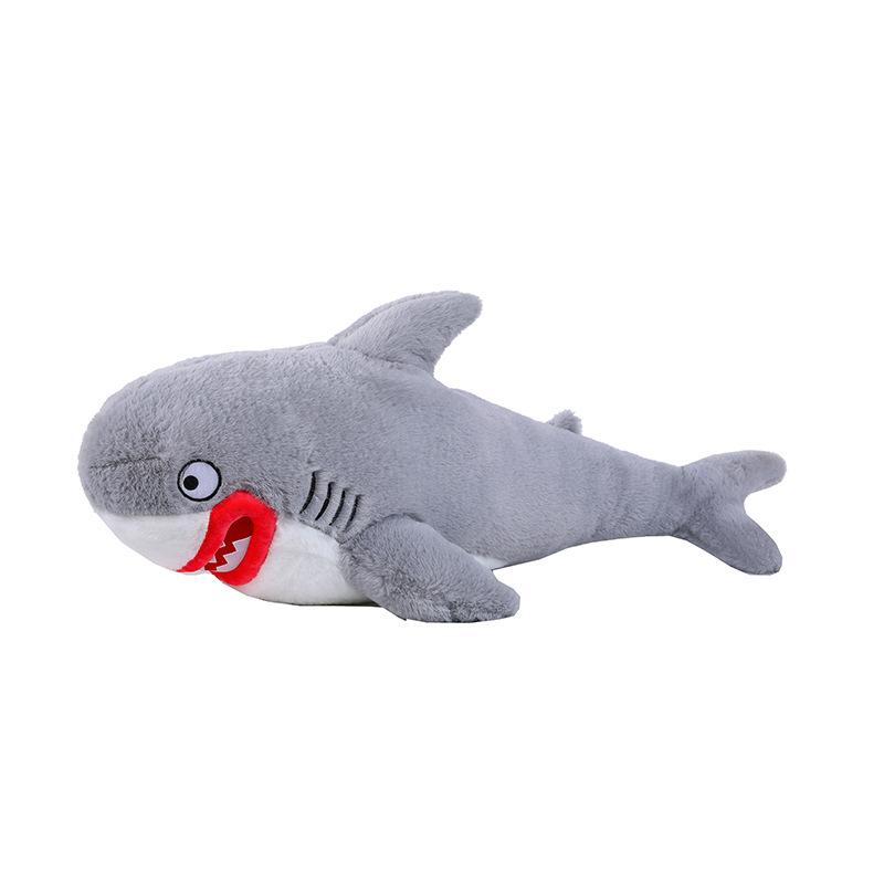 Lustiges rotlippiges Haifisch-Stofftier Lustige Megalodon-Haifischpuppe, schlafend mit Armen und Beinen auf dem Bett, Kissen umarmend