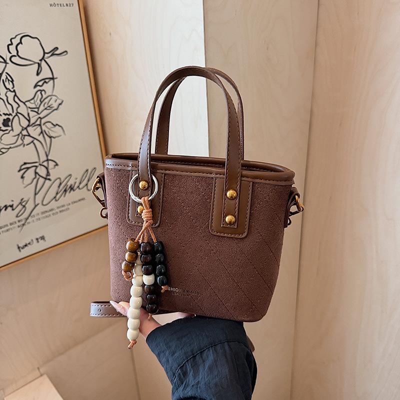 

Korean niche suede bucket bag women s 2025 autumn and winter new versatile shoulder bag premium messenger bag including pendant