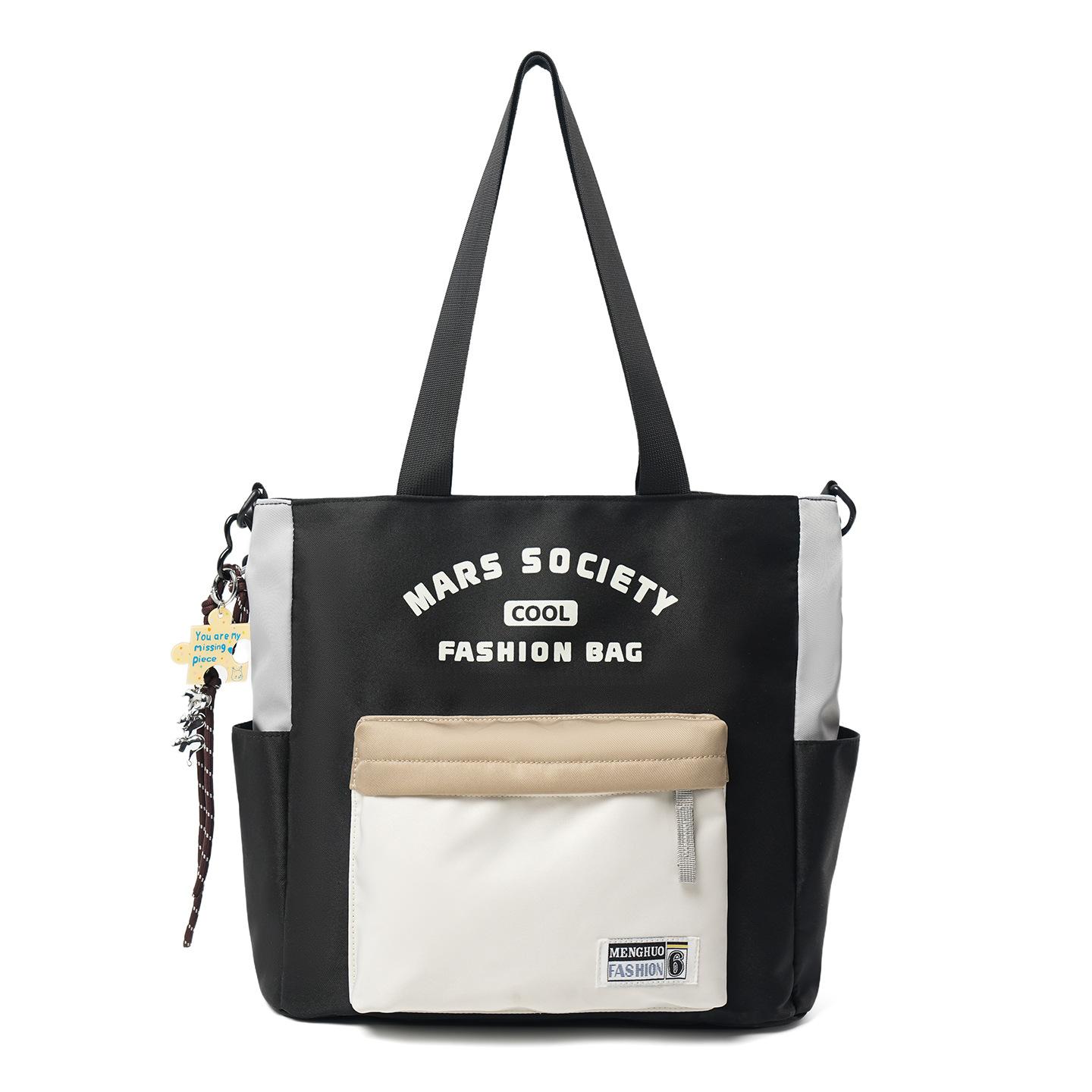 

Contrasting color splicing tote bag Large capacity shoulder bag Male and female students commuter bag College style portable dual-purpose messenger чорний