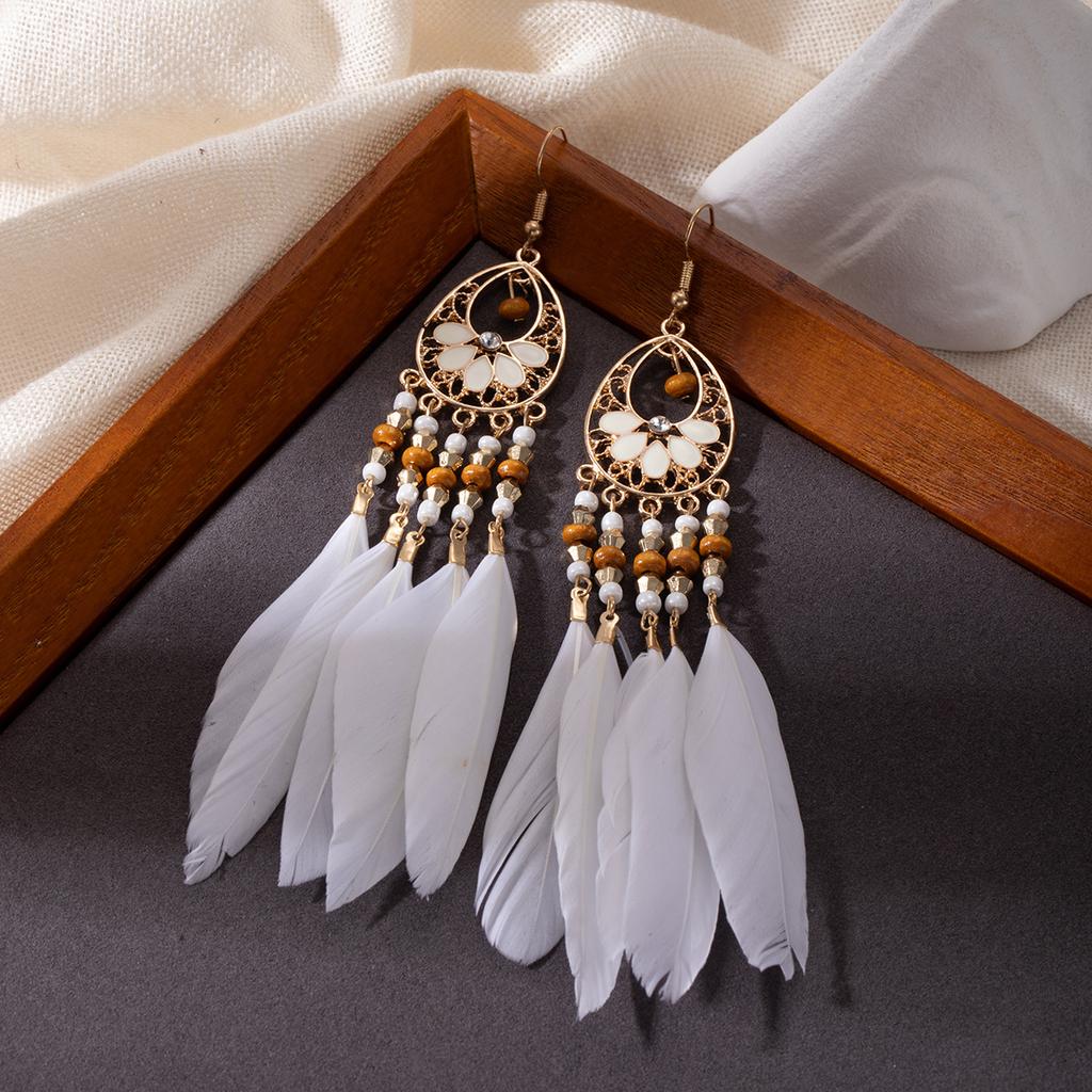 Retro ethnic style woven feathers long fringed earrings, bohemian high-end hollow rice bead earrings