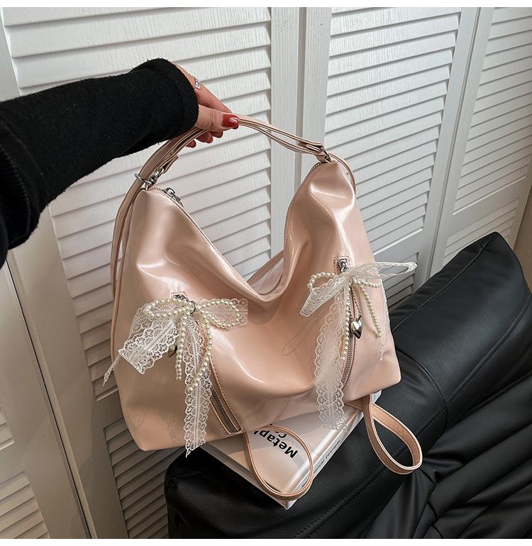 

Commuter tote bag women s large-capacity new versatile shoulder messenger bag multi-function lightweight backpack рожевий