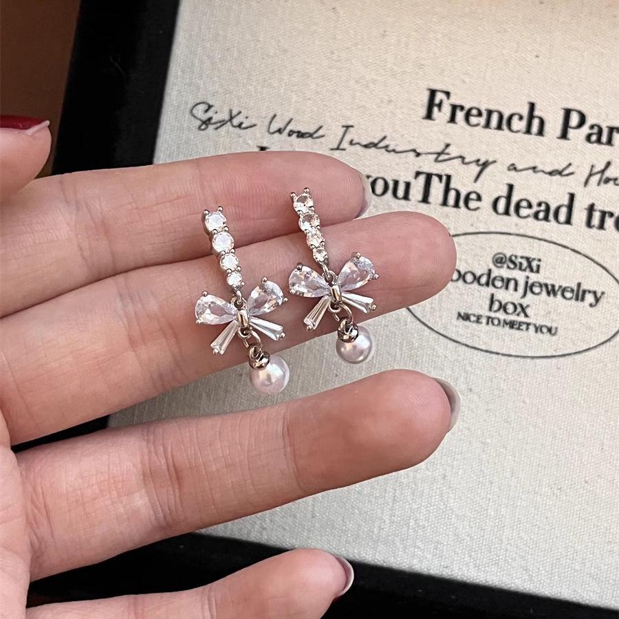

Exquisite Zircon Bow & Pearl Tassel Earrings for Women