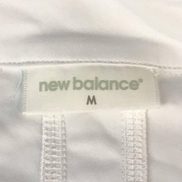 סט אימון New Balance ז'קט ומכנסיים מניילון לגברים מידה M סט ז'קט לבן(מְשׁוּמָשׁ)