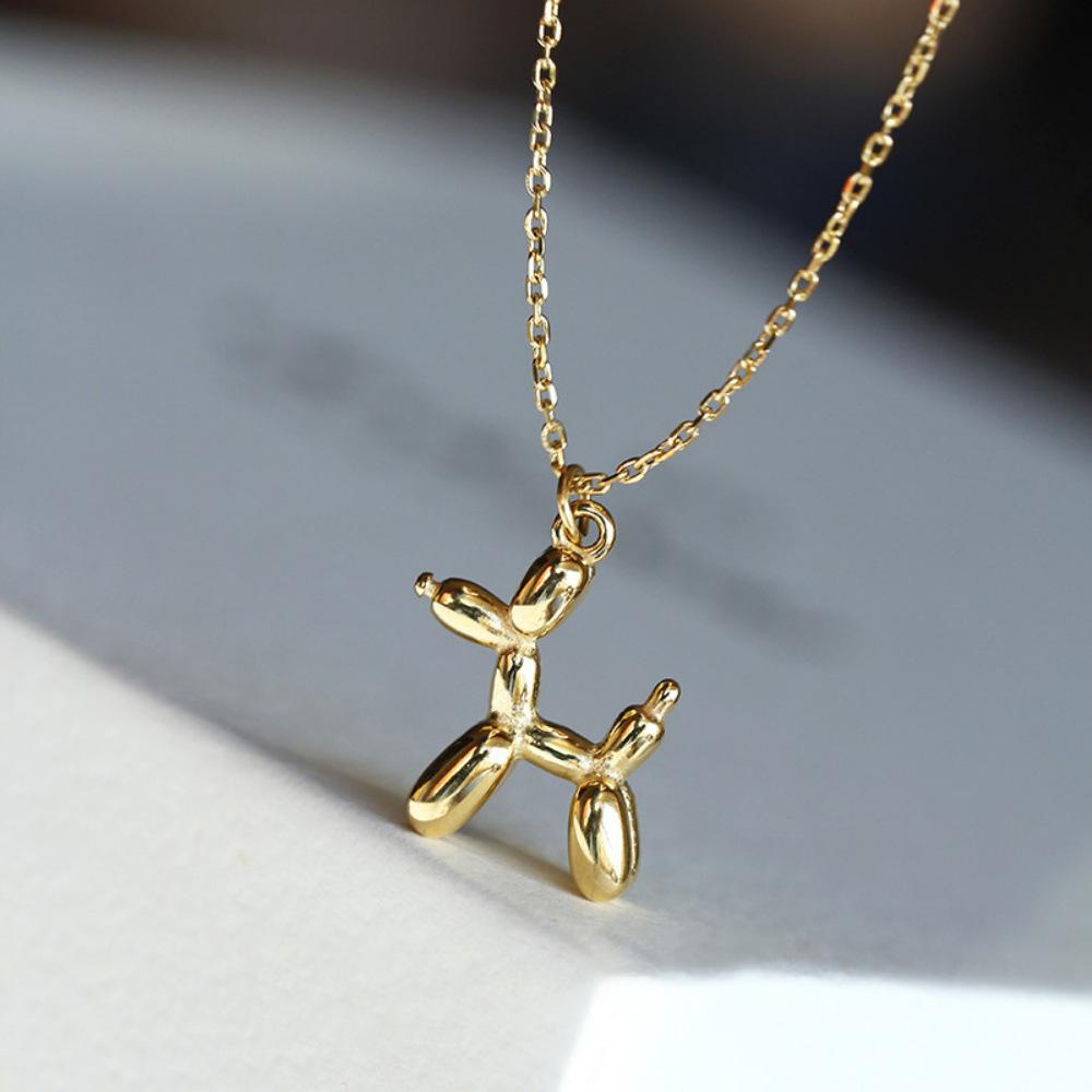 Gold-Tone Balloon Dog Pendant: Smooth lines, vivid form, finely polished, comfortable fit, natural color.