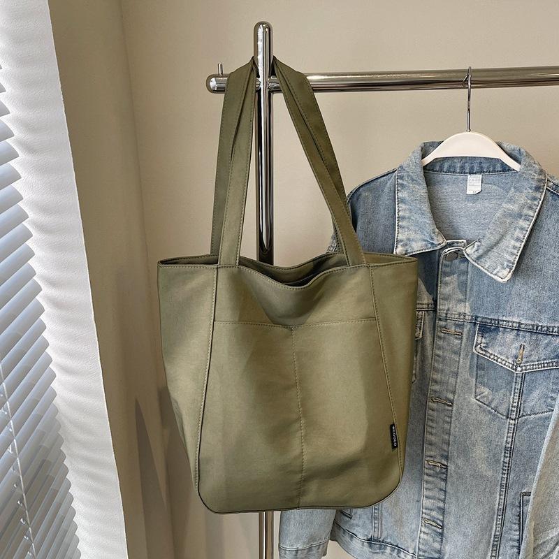 

Canvas bag women s 2025 new autumn large-capacity fashion simple shoulder bag college student commuting bucket bag зелёный