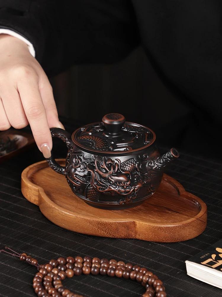 Teapot purple pottery material large capacity pure hand-carved retro relief desktop ornament household Chinese gift rotary pot
