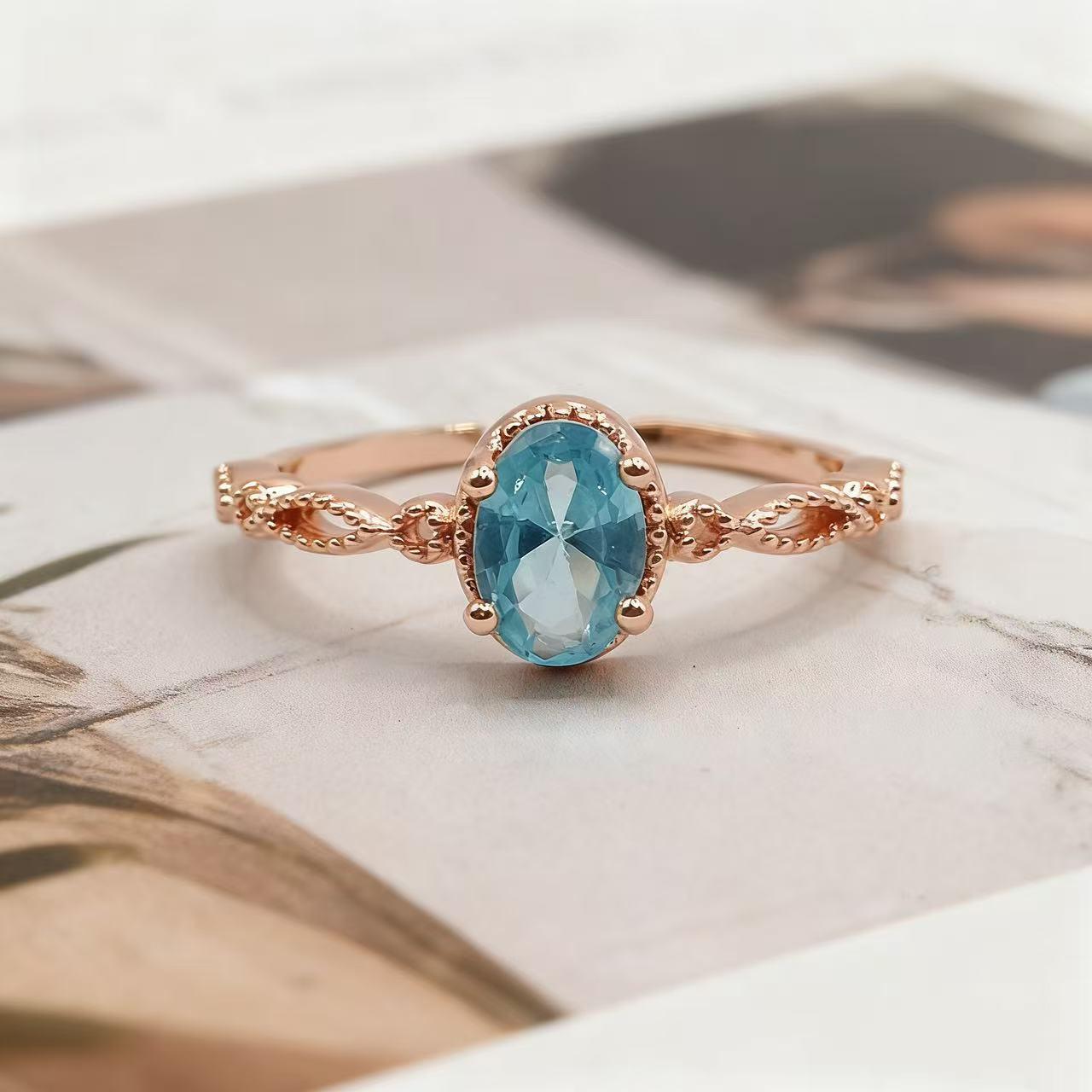 Yintai Rose Gold Blue Topaz Ring with Oval Zircon and Woven Band - Exquisite Light Luxury Jewelry Adjustable