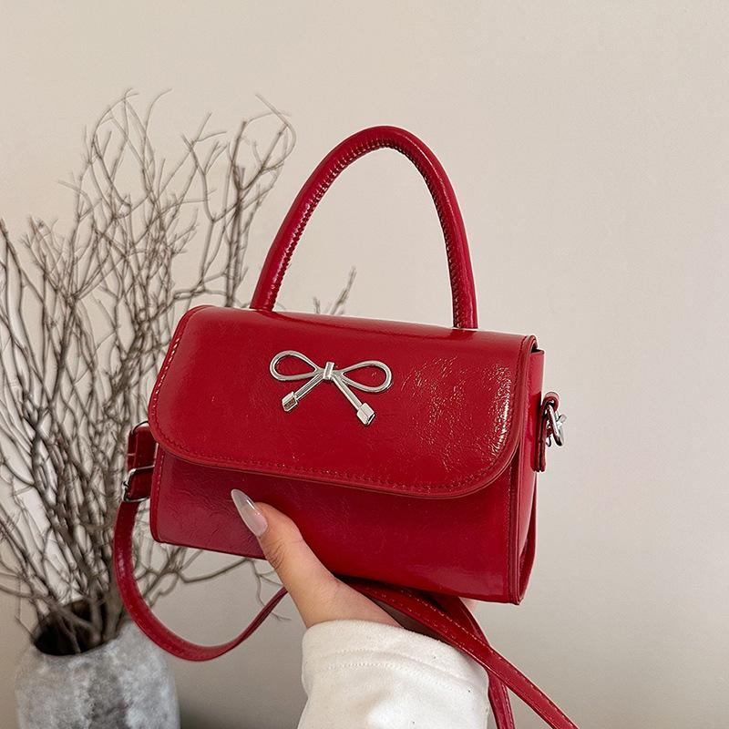 2025 simple solid color bow sewing line less fashionable casual oblique span single shoulder portable small square women's bag