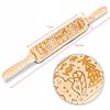 Wooden rolling pin with Christmas patterns and decorative engraving