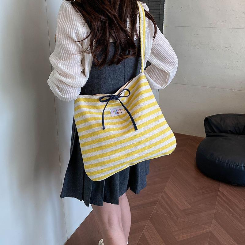 Casual striped canvas bag women's spring and summer new largecapacity commuter shoulder messenger bag