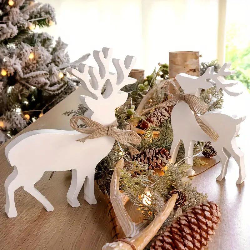 Weihnachtsrentierdekorationen, weiße Rentier-Holzbastelarbeiten, Kleiderschrankfensterbänke, festliche Atmosphäre Ornamente
