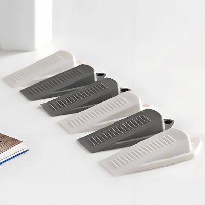 A segurança de borracha do suporte da rolha da parada da porta da cunha impede que a porta bata