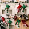 Christmas Playful Stockings In Rich Red And Green Fabric Featuring Snowflakes And Holiday Characters