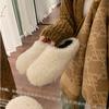Baotou lazy person one foot half drag hair shoes women wear 2025 autumn and winter flat bottom warm piled thick hair slippers
