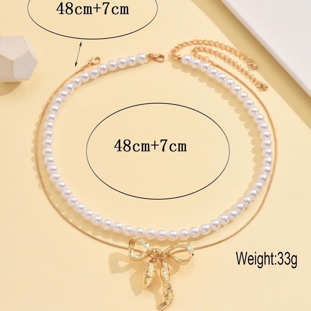 Elegant Faux Pearl & Metal Bow Pendant Necklace for Women