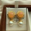 Round rope pattern gemstone pearl stud earrings retro elegant exquisite three-dimensional niche fashion gentle warm tone earrings