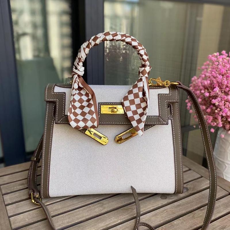 New temperament messenger bag women's canvas with leather bag contrasting color leather handbag fashion lock shoulder bag