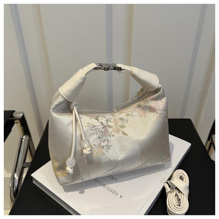 

2024 Женская летняя сумка кроссбоди с вышивкой в национальном стиле - Древняя и шикарная сумка-ведро белый