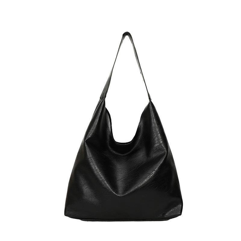 This year, large-capacity bags are popular for women's 2025 spring new shoulder bags, retro simple commuter textured tote bags.