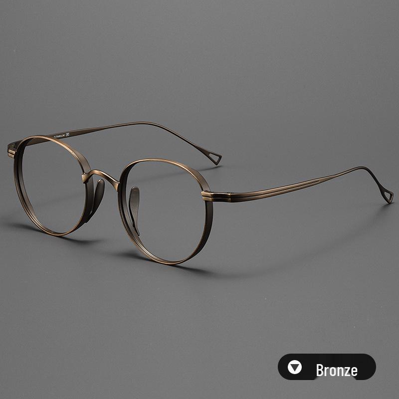 

Титановая круглая оправа для очков Danyang Wanniangui со встроенными носоупорами для маленьких лиц - Модель 10519