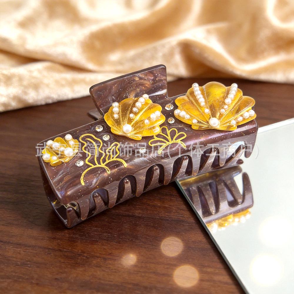 Elegancka spinka do włosów z cyrkoniami w kształcie rozgwiazdy i muszelkowa klamra do upięć