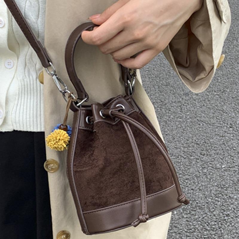 Stylish and simple contrasting color bucket bag women's autumn new shoulder messenger bag high value casual strap handbag