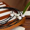 The Store Recommends a Natural Freshwater Baroque Pearl Necklace with a Faux Black Spinel Clavicle Chain