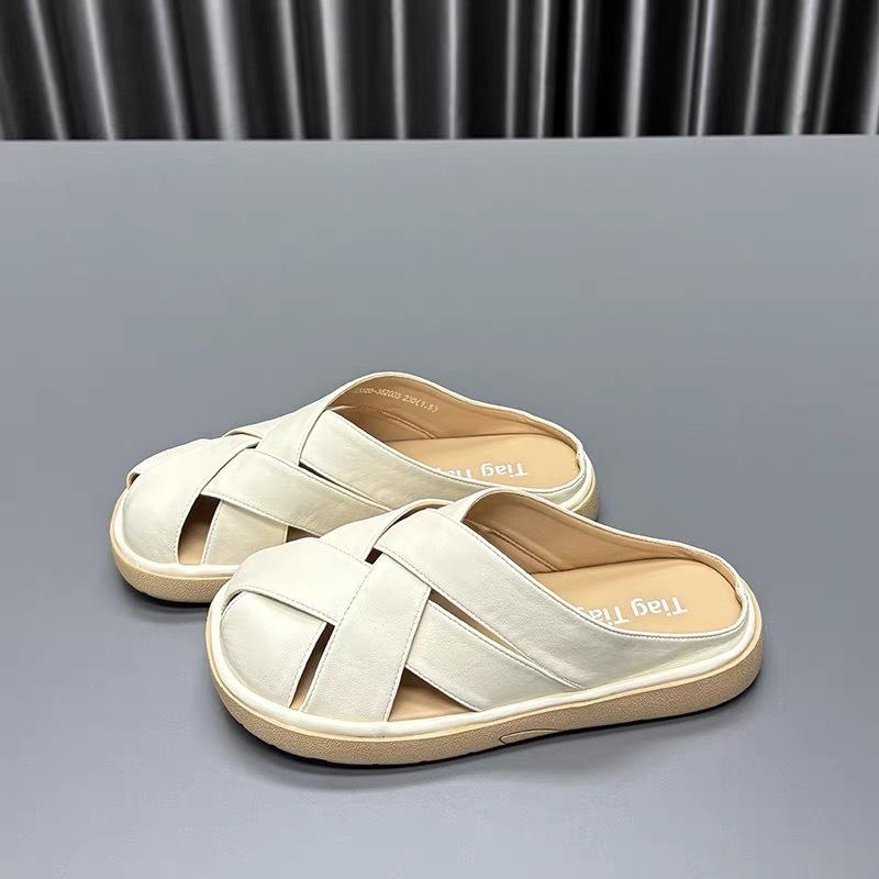 Woven French bag head slippers women's 2025 summer new flat bottom hollow fashion high sense with skirt cool slippers