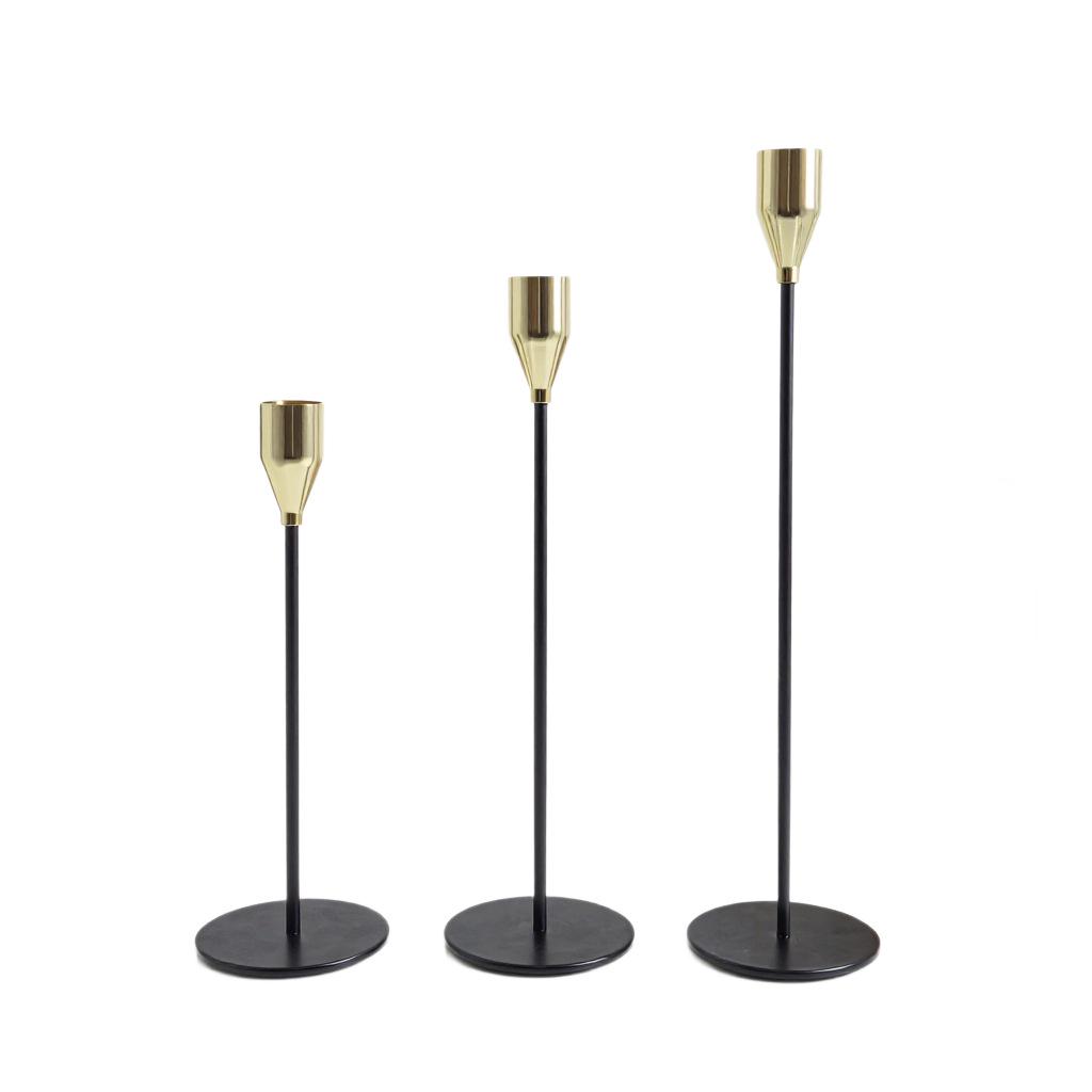 

Elegant European Candle Holder Set: Electroplated Three-Piece Metal Ornament for High-End Dining and Wedding Décor.