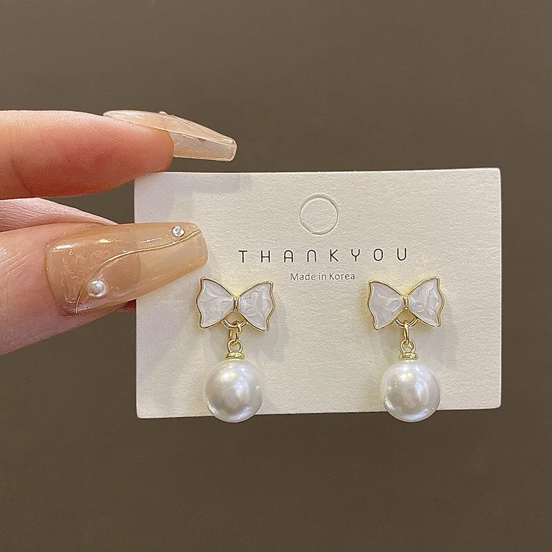 925 silver needle drip glaze bow earrings women s retro niche pearl earrings cold wind personalized ears