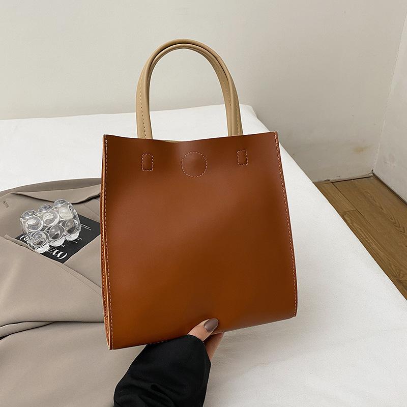 

2025 spring new girls simple shoulder bag texture commuter portable small square bag niche tote bag high sense коричневый