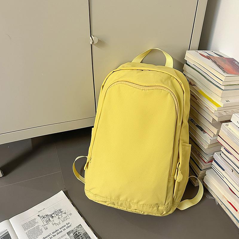 Solid color high-end backpack junior high school students casual simple travel large-capacity backpack