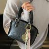 Korean Version of the New Casual Temperament Cute Embossed Portable Bucket Bag High-end Commuter Niche Design Messenger Bag Women