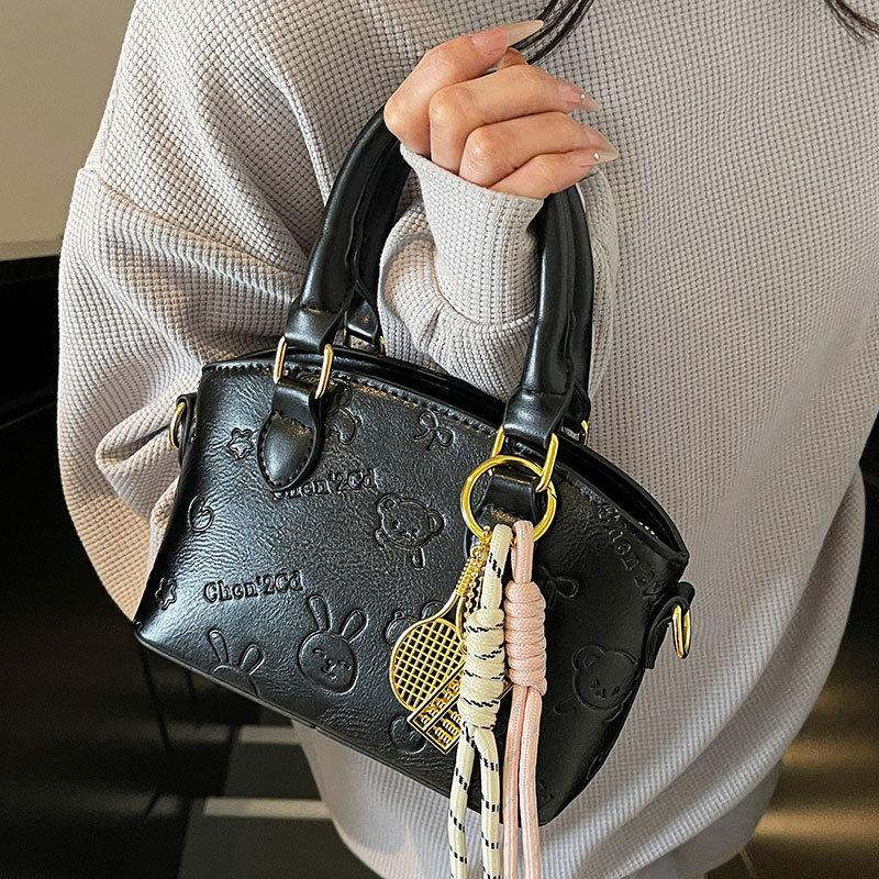 Korean Version of the New Casual Temperament Cute Embossed Portable Bucket Bag High-end Commuter Niche Design Messenger Bag Women