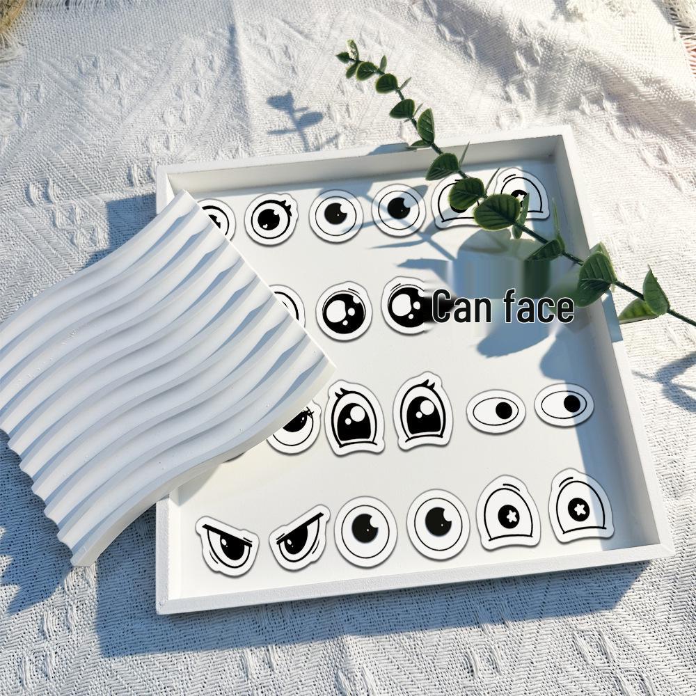 Roll of 500 Small Emoticon Wavy Eyes Stickers for Journaling, Decoration, and Envelope Sealing.