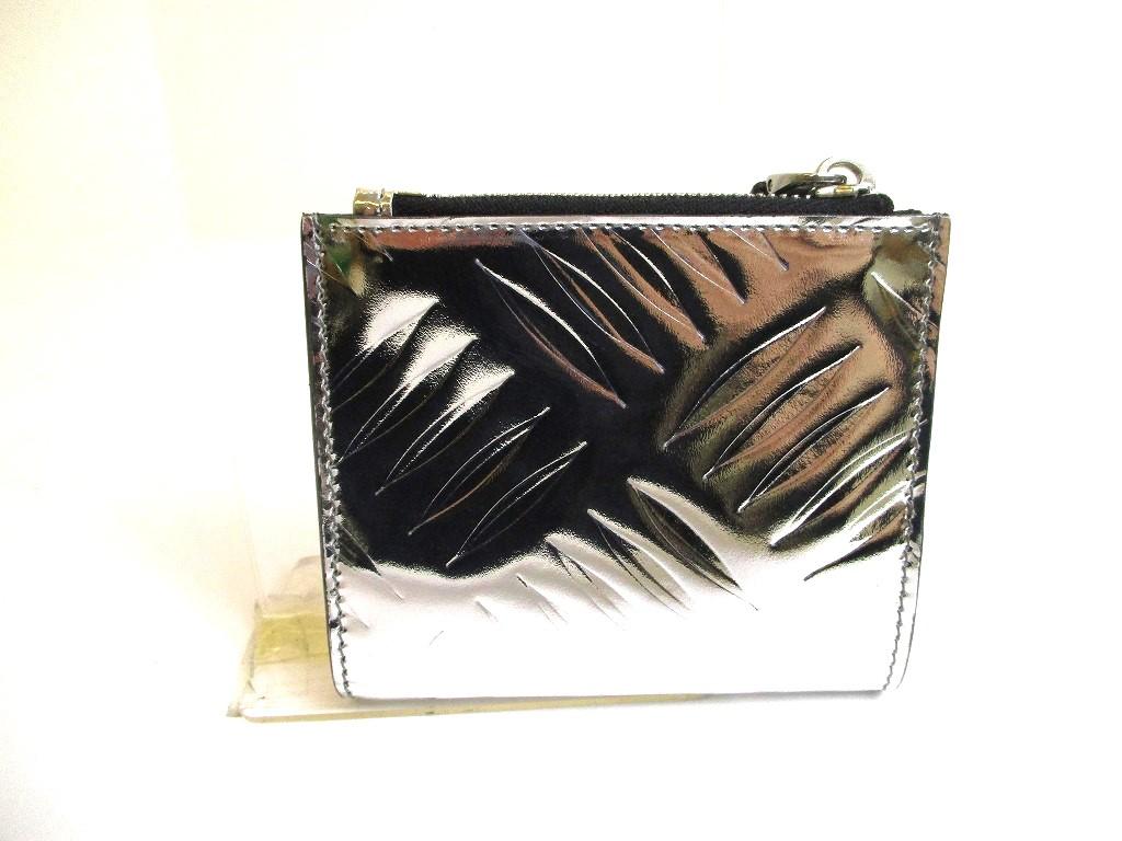 Prada Portefeuille compact à deux volets en cuir argenté et noir #a592