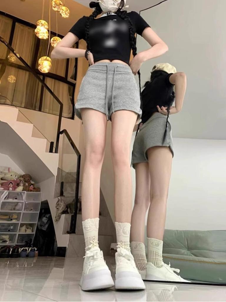 Women's Spicy Girl Black Drawstring Casual Shorts: Autumn Elastic Waist, Slit Straight Leg, Solid Color Fashion.