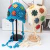 Handmade crocheted ear protection hat women's autumn and winter ethnic style colored flower knitted hat fringed strap ball bag head wool hat